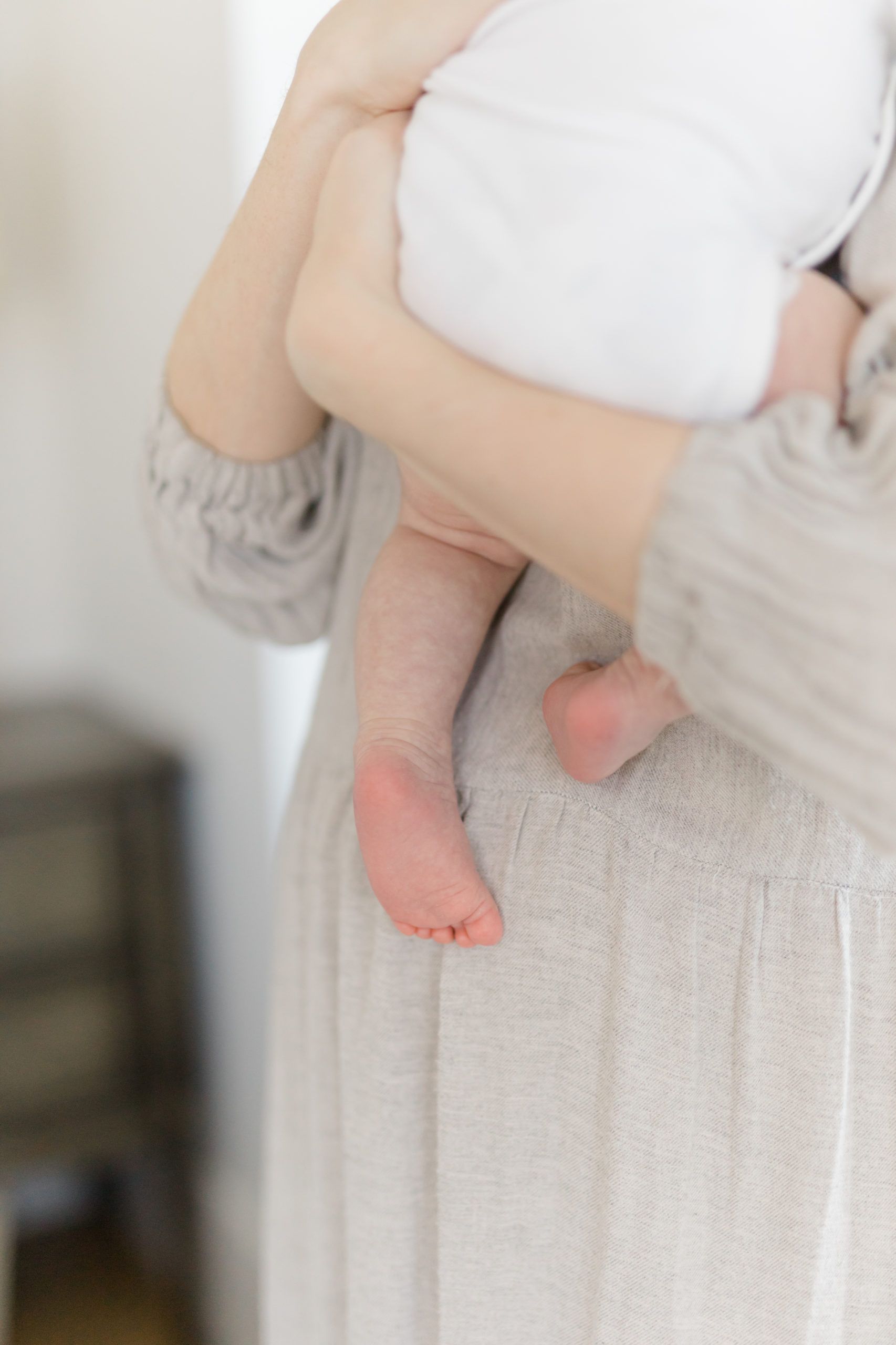 Details of a baby's feet at an in home newborn photography session in NYC photographed by Jacqueline Clair Family Photography. 