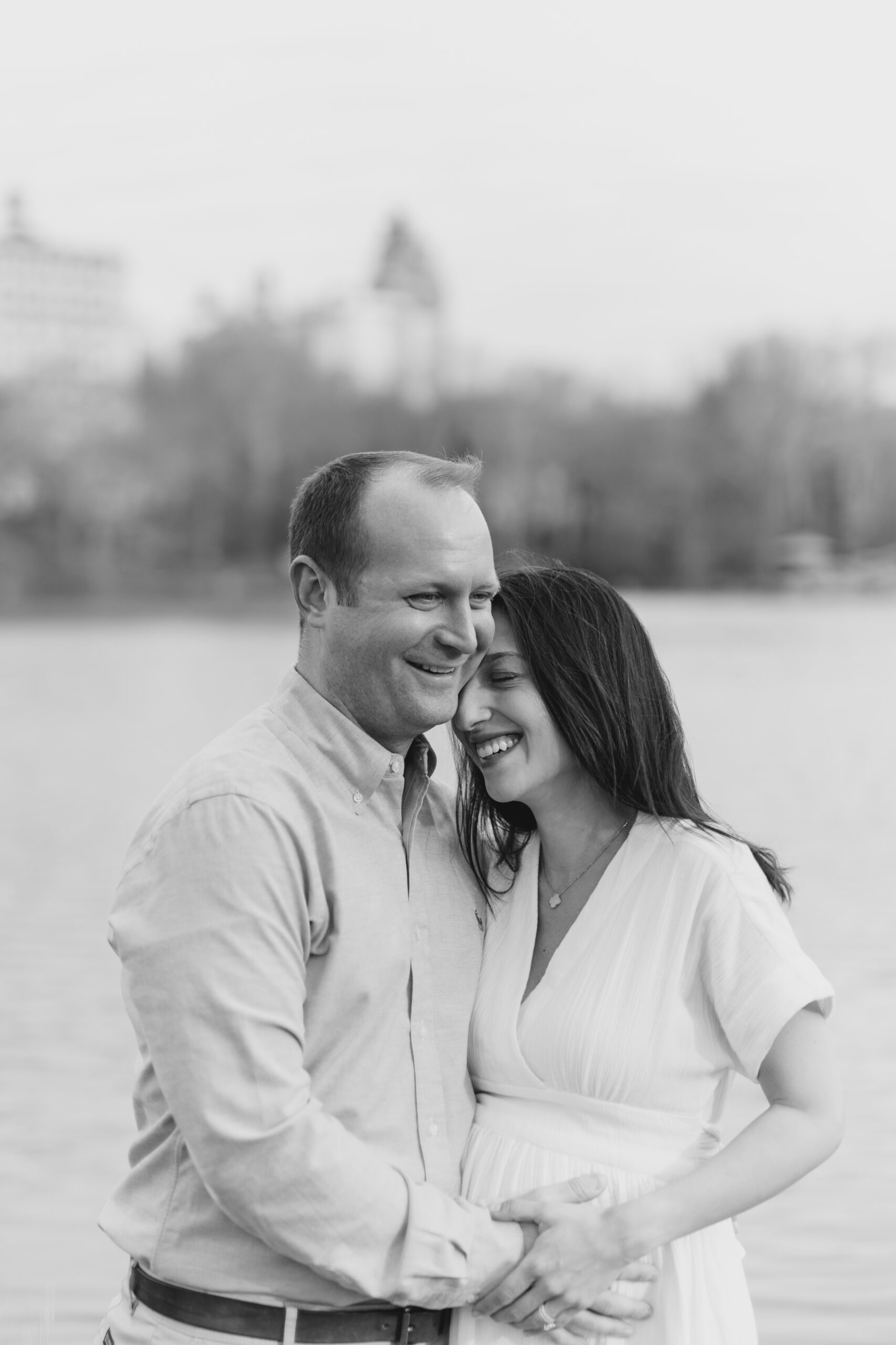 A black and white shot of an expecting couple in Central Park during a New York City maternity photography session with Jacqueline Clair Photography