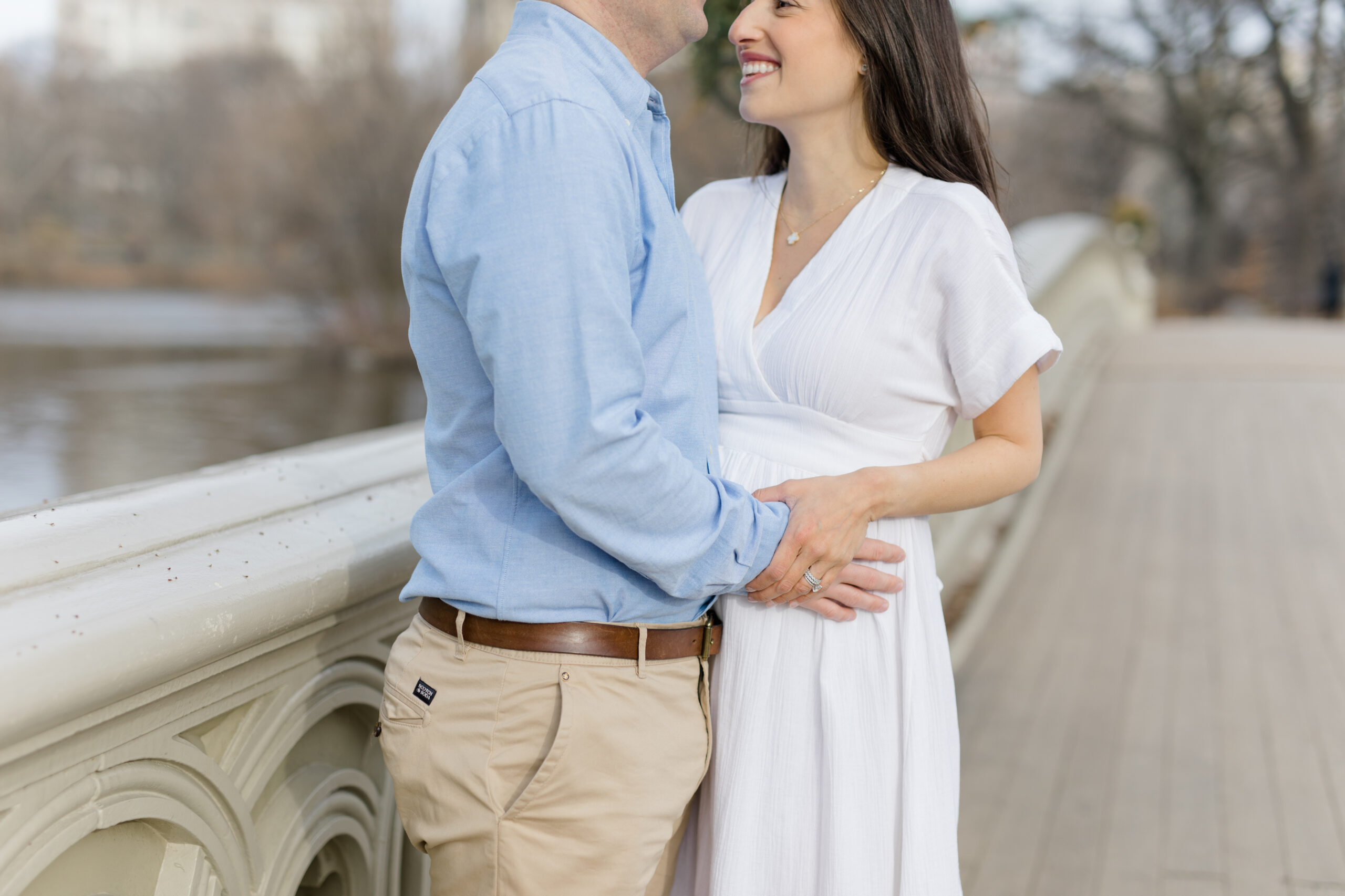 A couple together in Central Park during a New York City maternity photography session with Jacqueline Clair Photography