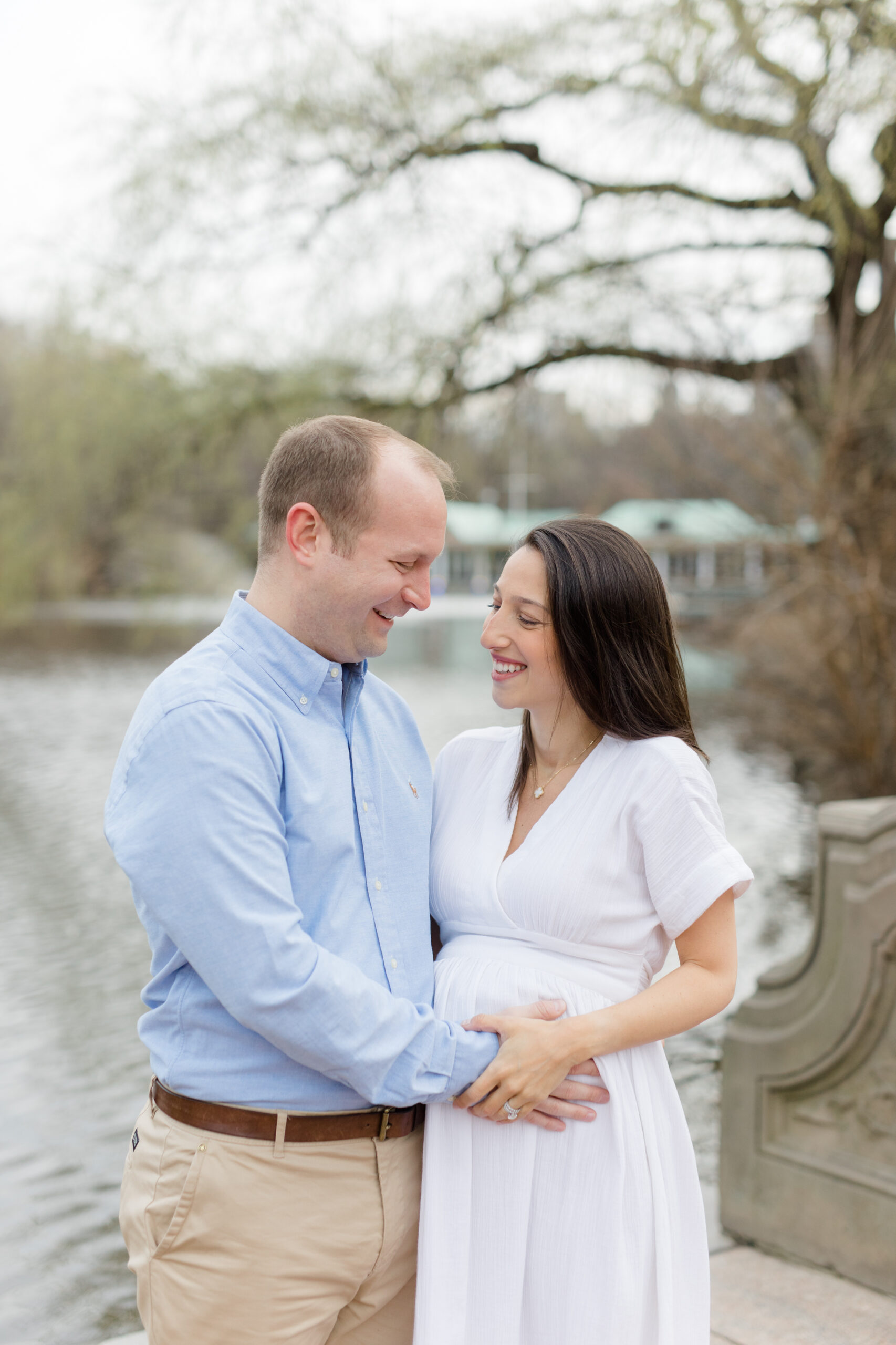 An expecting couple together in Central Park during a New York City maternity photography session with Jacqueline Clair Photography