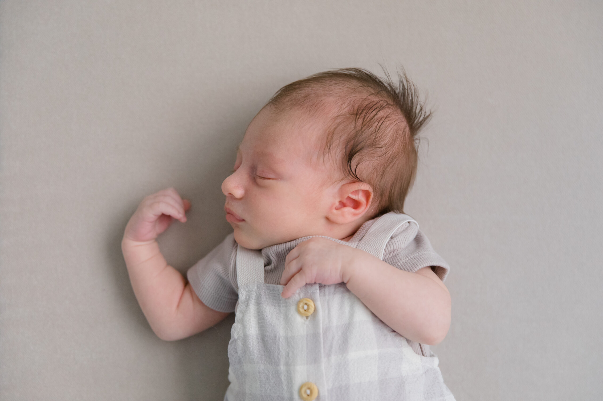 A baby sleeping at a newborn session with New York City newborn photographer Jacqueline Clair